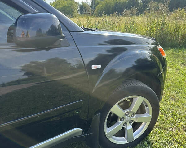 Черный Мицубиси Аутлендер, объемом двигателя 2.36 л и пробегом 240 тыс. км за 9599 $, фото 11 на Automoto.ua