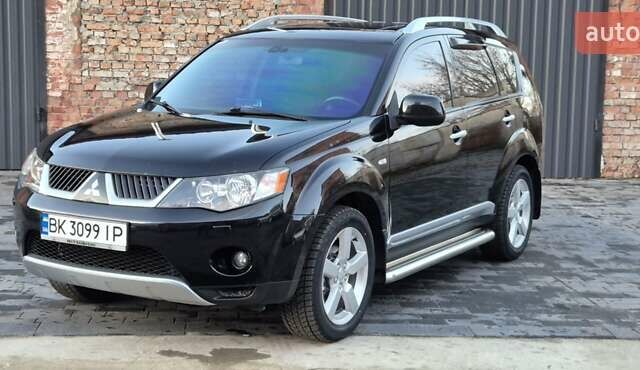 Чорний Міцубісі Аутлендер, об'ємом двигуна 2.4 л та пробігом 230 тис. км за 9700 $, фото 1 на Automoto.ua