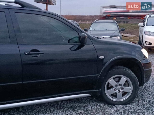 Чорний Міцубісі Аутлендер, об'ємом двигуна 2 л та пробігом 271 тис. км за 6940 $, фото 10 на Automoto.ua