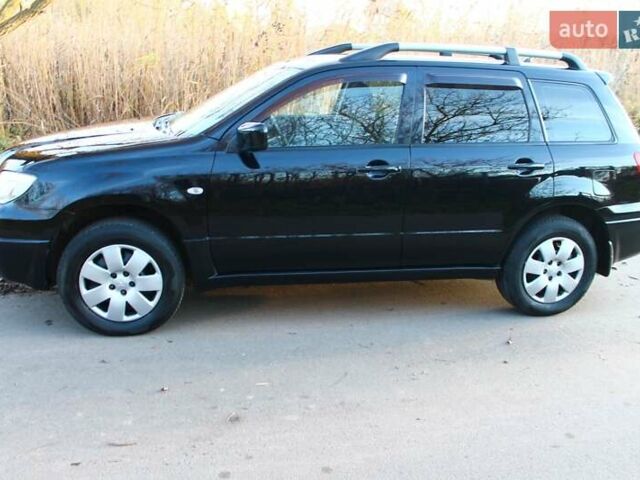 Черный Мицубиси Аутлендер, объемом двигателя 2 л и пробегом 189 тыс. км за 7200 $, фото 34 на Automoto.ua