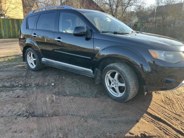 Черный Мицубиси Аутлендер, объемом двигателя 2 л и пробегом 247 тыс. км за 4600 $, фото 4 на Automoto.ua