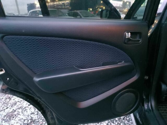 Черный Мицубиси Аутлендер, объемом двигателя 2 л и пробегом 271 тыс. км за 6940 $, фото 16 на Automoto.ua