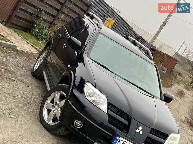 Черный Мицубиси Аутлендер, объемом двигателя 2.4 л и пробегом 178 тыс. км за 6900 $, фото 1 на Automoto.ua