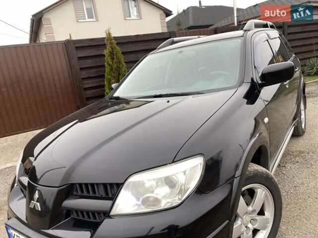 Черный Мицубиси Аутлендер, объемом двигателя 2.4 л и пробегом 178 тыс. км за 6900 $, фото 11 на Automoto.ua