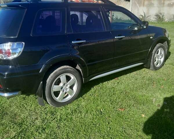 Чорний Міцубісі Аутлендер, об'ємом двигуна 2.38 л та пробігом 161 тис. км за 7500 $, фото 7 на Automoto.ua