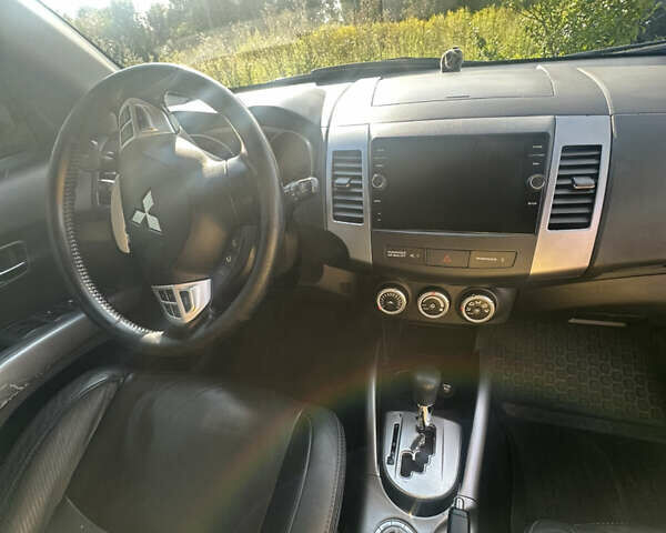 Черный Мицубиси Аутлендер, объемом двигателя 2.36 л и пробегом 240 тыс. км за 9599 $, фото 29 на Automoto.ua