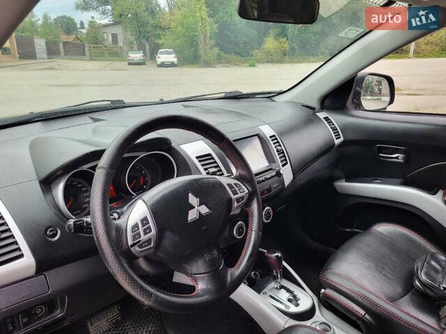 Чорний Міцубісі Аутлендер, об'ємом двигуна 2.4 л та пробігом 205 тис. км за 8400 $, фото 22 на Automoto.ua