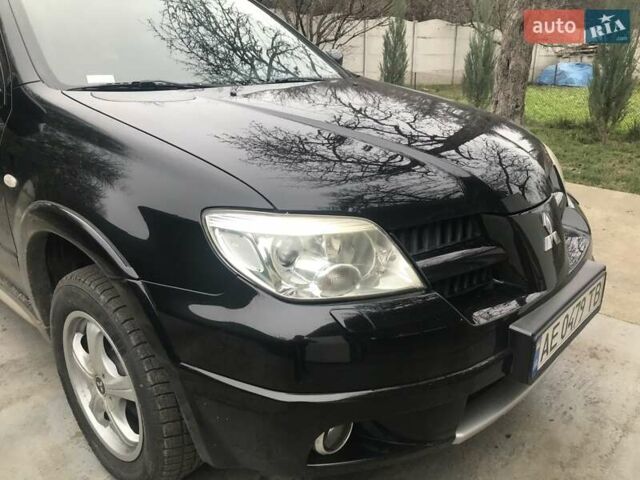 Чорний Міцубісі Аутлендер, об'ємом двигуна 2.38 л та пробігом 207 тис. км за 7000 $, фото 14 на Automoto.ua
