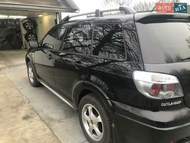 Чорний Міцубісі Аутлендер, об'ємом двигуна 2.38 л та пробігом 207 тис. км за 7000 $, фото 4 на Automoto.ua