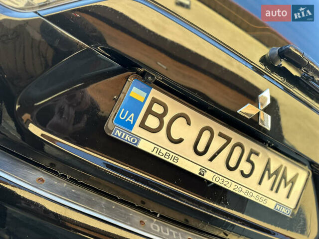 Черный Мицубиси Аутлендер, объемом двигателя 2.36 л и пробегом 253 тыс. км за 9600 $, фото 13 на Automoto.ua