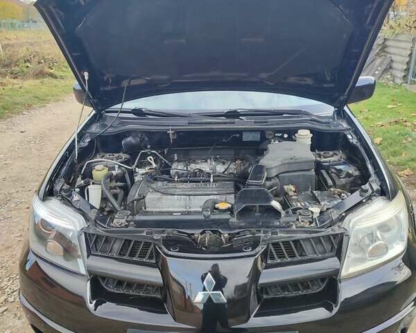 Міцубісі Аутлендер 2008 у Івано-Франківську на Automoto.ua Чорний Міцубісі Аутлендер, об'ємом двигуна 2 л та пробігом 128 тис. км за 7000 $, фото 35 на Automoto.ua