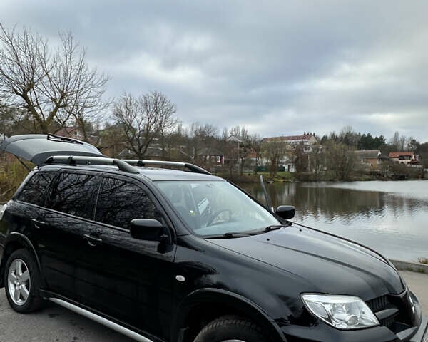 Чорний Міцубісі Аутлендер, об'ємом двигуна 2 л та пробігом 118 тис. км за 8100 $, фото 42 на Automoto.ua