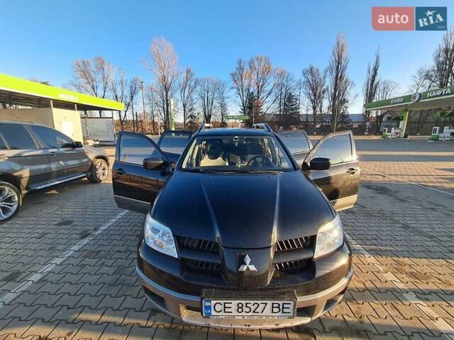 Черный Мицубиси Аутлендер, объемом двигателя 2 л и пробегом 190 тыс. км за 8000 $, фото 5 на Automoto.ua