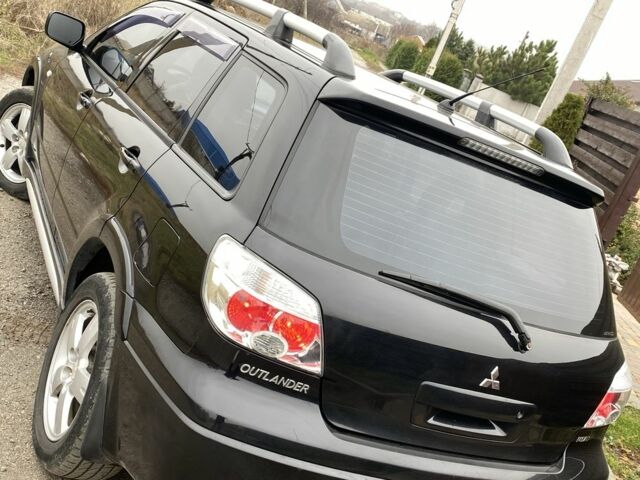 Черный Мицубиси Аутлендер, объемом двигателя 2.4 л и пробегом 178 тыс. км за 6900 $, фото 16 на Automoto.ua