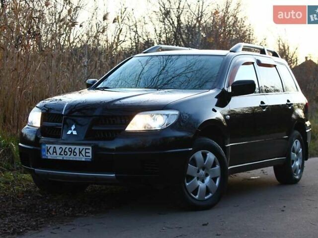 Черный Мицубиси Аутлендер, объемом двигателя 2 л и пробегом 189 тыс. км за 7200 $, фото 15 на Automoto.ua