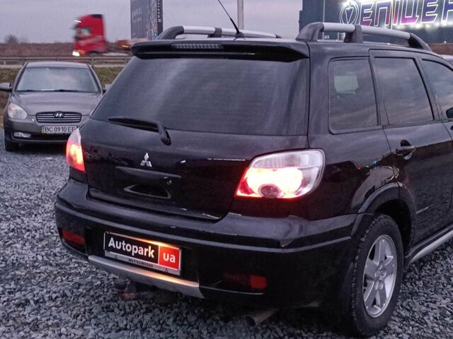 Черный Мицубиси Аутлендер, объемом двигателя 2 л и пробегом 271 тыс. км за 6940 $, фото 7 на Automoto.ua