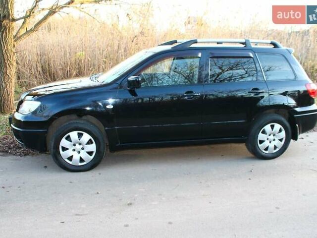 Черный Мицубиси Аутлендер, объемом двигателя 2 л и пробегом 189 тыс. км за 7200 $, фото 33 на Automoto.ua