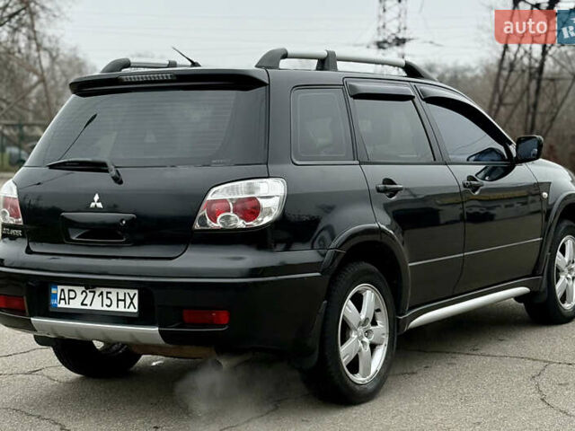 Черный Мицубиси Аутлендер, объемом двигателя 2.4 л и пробегом 245 тыс. км за 6500 $, фото 6 на Automoto.ua