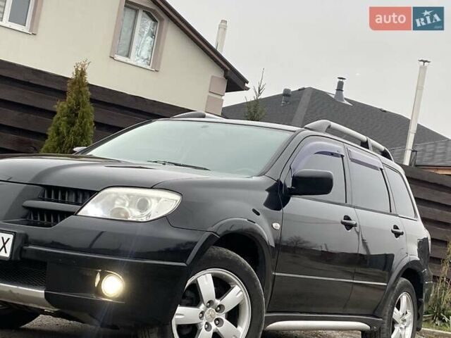 Черный Мицубиси Аутлендер, объемом двигателя 2.4 л и пробегом 178 тыс. км за 6900 $, фото 5 на Automoto.ua