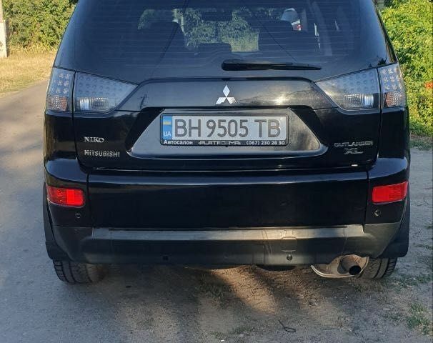 Чорний Міцубісі Аутлендер, об'ємом двигуна 2.4 л та пробігом 325 тис. км за 7500 $, фото 3 на Automoto.ua