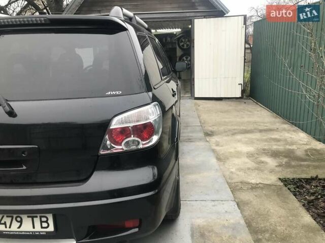 Чорний Міцубісі Аутлендер, об'ємом двигуна 2.38 л та пробігом 207 тис. км за 7000 $, фото 8 на Automoto.ua