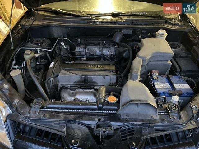 Черный Мицубиси Аутлендер, объемом двигателя 2 л и пробегом 306 тыс. км за 6500 $, фото 23 на Automoto.ua