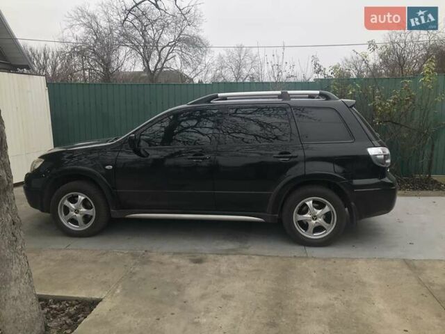 Чорний Міцубісі Аутлендер, об'ємом двигуна 2.38 л та пробігом 207 тис. км за 7000 $, фото 2 на Automoto.ua
