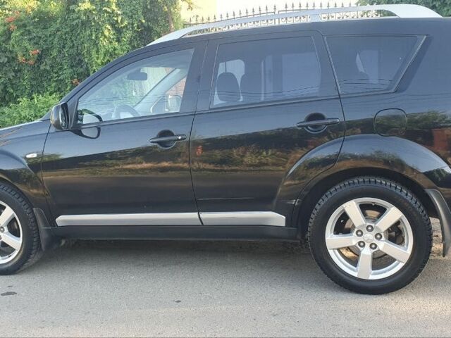 Чорний Міцубісі Аутлендер, об'ємом двигуна 2.4 л та пробігом 325 тис. км за 7500 $, фото 2 на Automoto.ua