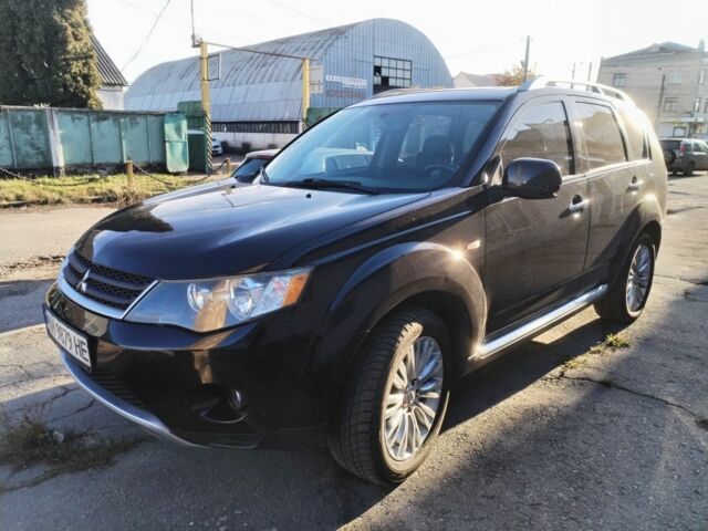 Черный Мицубиси Аутлендер, объемом двигателя 2.4 л и пробегом 199 тыс. км за 9000 $, фото 1 на Automoto.ua