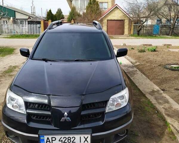 Черный Мицубиси Аутлендер, объемом двигателя 2 л и пробегом 263 тыс. км за 6900 $, фото 3 на Automoto.ua
