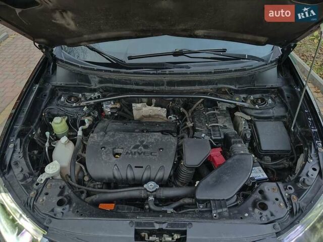 Черный Мицубиси Аутлендер, объемом двигателя 2.36 л и пробегом 192 тыс. км за 8800 $, фото 20 на Automoto.ua