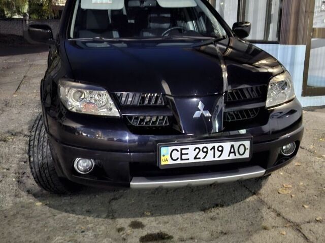 Чорний Міцубісі Аутлендер, об'ємом двигуна 2 л та пробігом 117 тис. км за 7900 $, фото 1 на Automoto.ua