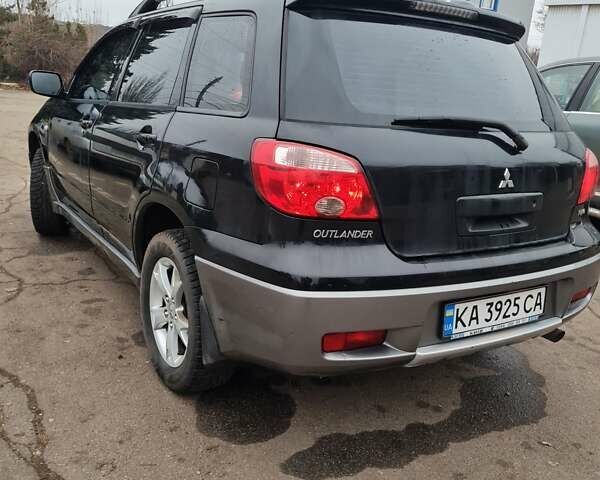 Черный Мицубиси Аутлендер, объемом двигателя 2 л и пробегом 212 тыс. км за 7900 $, фото 2 на Automoto.ua