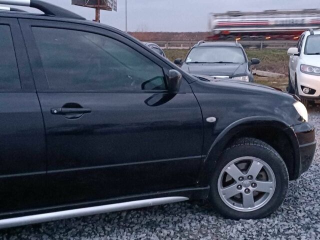 Черный Мицубиси Аутлендер, объемом двигателя 2 л и пробегом 271 тыс. км за 6940 $, фото 10 на Automoto.ua