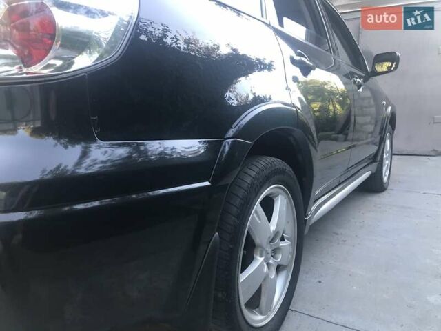 Чорний Міцубісі Аутлендер, об'ємом двигуна 2.38 л та пробігом 207 тис. км за 7000 $, фото 81 на Automoto.ua