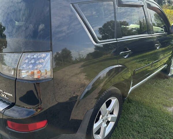 Черный Мицубиси Аутлендер, объемом двигателя 2.36 л и пробегом 240 тыс. км за 9599 $, фото 13 на Automoto.ua