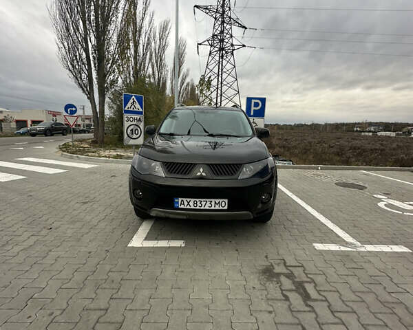 Чорний Міцубісі Аутлендер, об'ємом двигуна 2.4 л та пробігом 218 тис. км за 10000 $, фото 11 на Automoto.ua