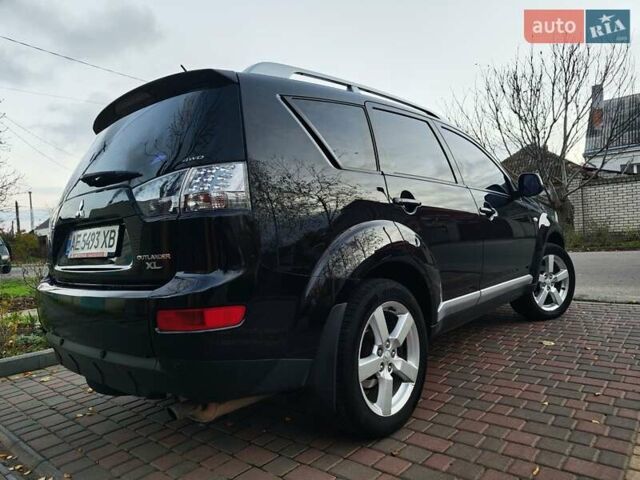 Черный Мицубиси Аутлендер, объемом двигателя 2.36 л и пробегом 192 тыс. км за 8800 $, фото 1 на Automoto.ua