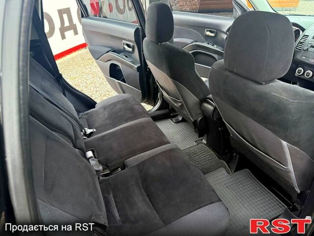 Черный Мицубиси Аутлендер, объемом двигателя 2.4 л и пробегом 200 тыс. км за 9999 $, фото 6 на Automoto.ua