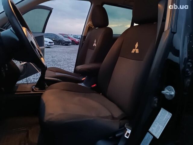 Черный Мицубиси Аутлендер, объемом двигателя 2 л и пробегом 271 тыс. км за 6940 $, фото 29 на Automoto.ua