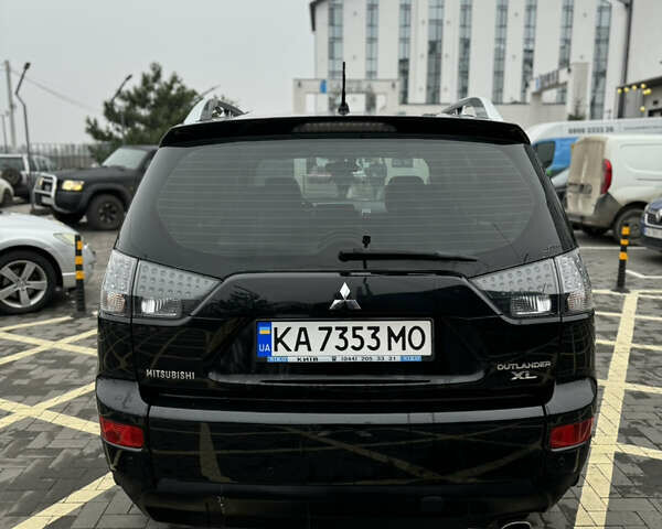 Черный Мицубиси Аутлендер, объемом двигателя 2.36 л и пробегом 120 тыс. км за 10100 $, фото 3 на Automoto.ua