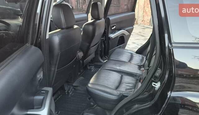 Чорний Міцубісі Аутлендер, об'ємом двигуна 2.4 л та пробігом 230 тис. км за 9700 $, фото 11 на Automoto.ua