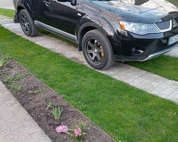 Черный Мицубиси Аутлендер, объемом двигателя 2.35 л и пробегом 245 тыс. км за 8000 $, фото 27 на Automoto.ua