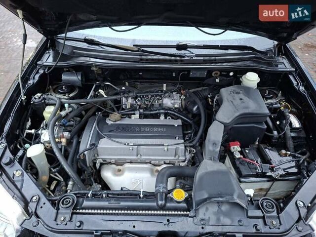 Чорний Міцубісі Аутлендер, об'ємом двигуна 2 л та пробігом 191 тис. км за 7100 $, фото 2 на Automoto.ua