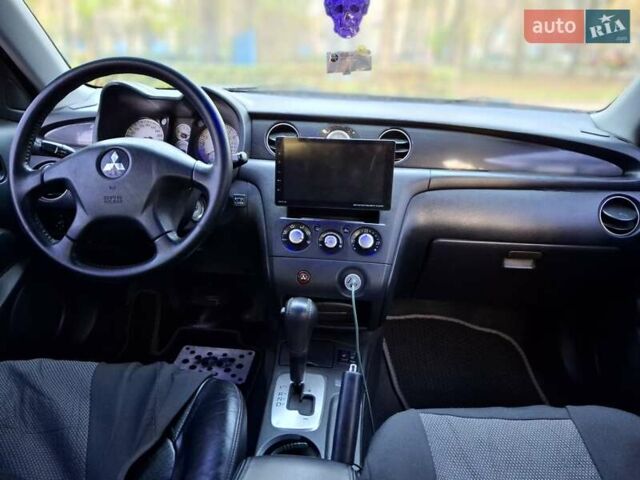 Чорний Міцубісі Аутлендер, об'ємом двигуна 2.38 л та пробігом 245 тис. км за 6800 $, фото 3 на Automoto.ua