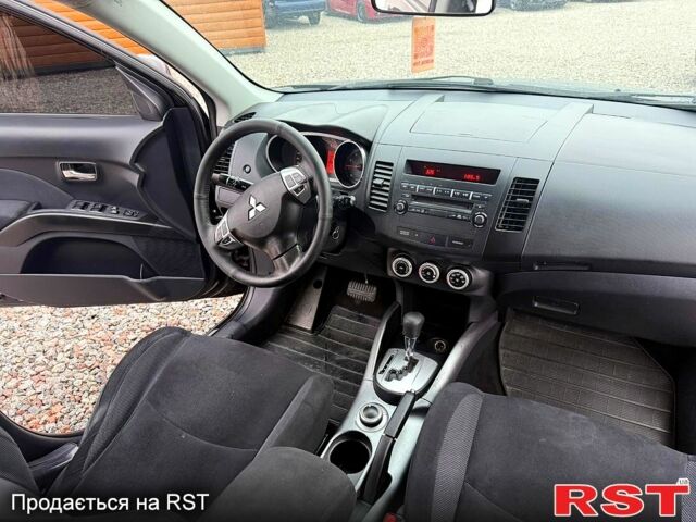 Черный Мицубиси Аутлендер, объемом двигателя 2.4 л и пробегом 200 тыс. км за 9999 $, фото 7 на Automoto.ua