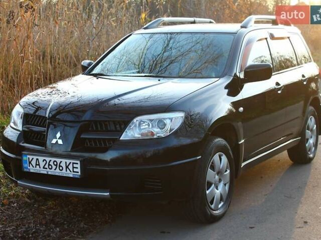 Черный Мицубиси Аутлендер, объемом двигателя 2 л и пробегом 190 тыс. км за 6900 $, фото 31 на Automoto.ua