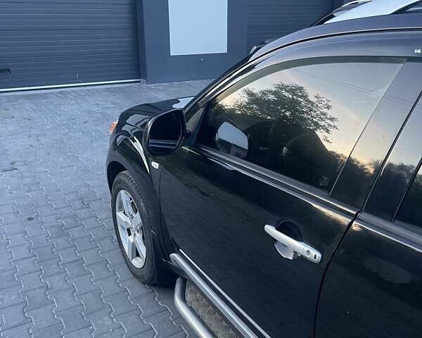 Черный Мицубиси Аутлендер, объемом двигателя 2.4 л и пробегом 290 тыс. км за 9500 $, фото 4 на Automoto.ua