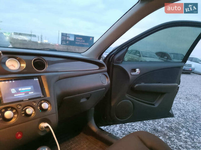 Чорний Міцубісі Аутлендер, об'ємом двигуна 2 л та пробігом 271 тис. км за 6940 $, фото 28 на Automoto.ua