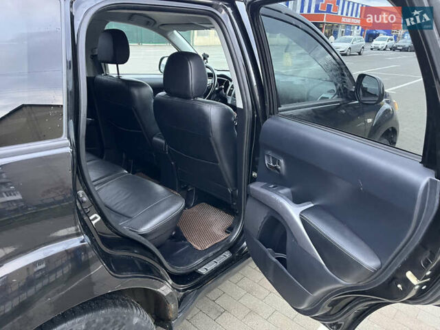 Черный Мицубиси Аутлендер, объемом двигателя 1.97 л и пробегом 244 тыс. км за 8700 $, фото 15 на Automoto.ua